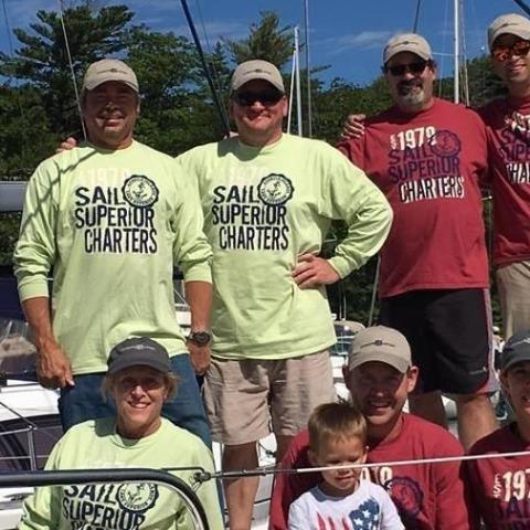 advanced sailing certificate graduates together on sailboat