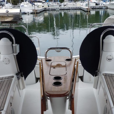 a boat is docked next to a body of water