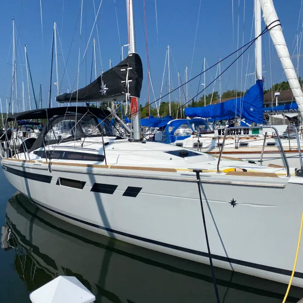 a boat is docked next to a body of water