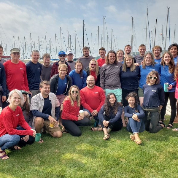 Sailing Club group picture out on lawn in front of harbor
