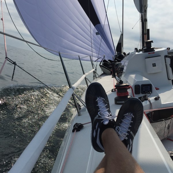 Photo of feet kicked up on sailboat