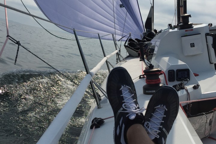 Photo of feet kicked up on sailboat