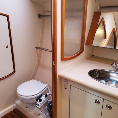 a kitchen with a sink and a mirror