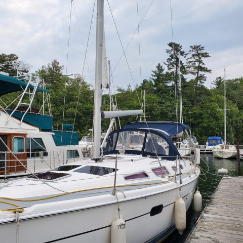 a boat is docked next to a body of water