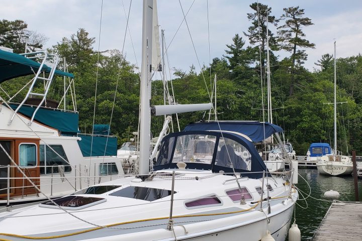 a boat is docked next to a body of water