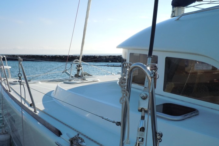 a boat is docked next to a body of water