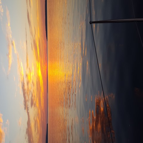 a sunset over a body of water