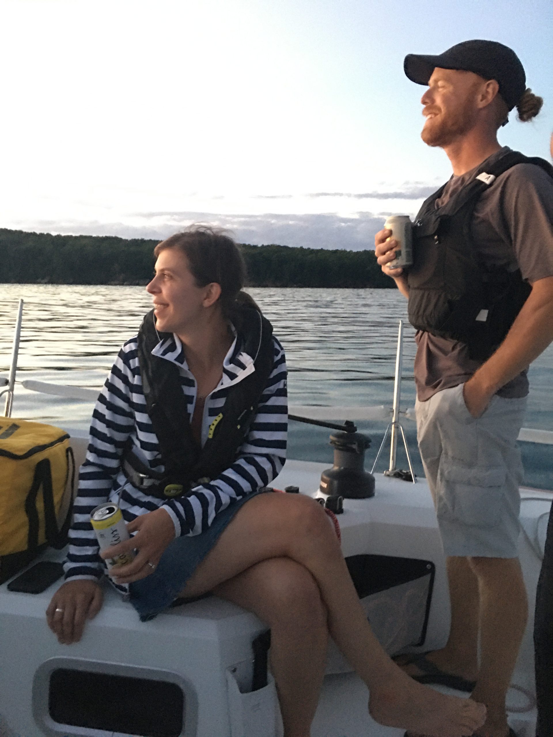 a man sitting in a boat on a body of water