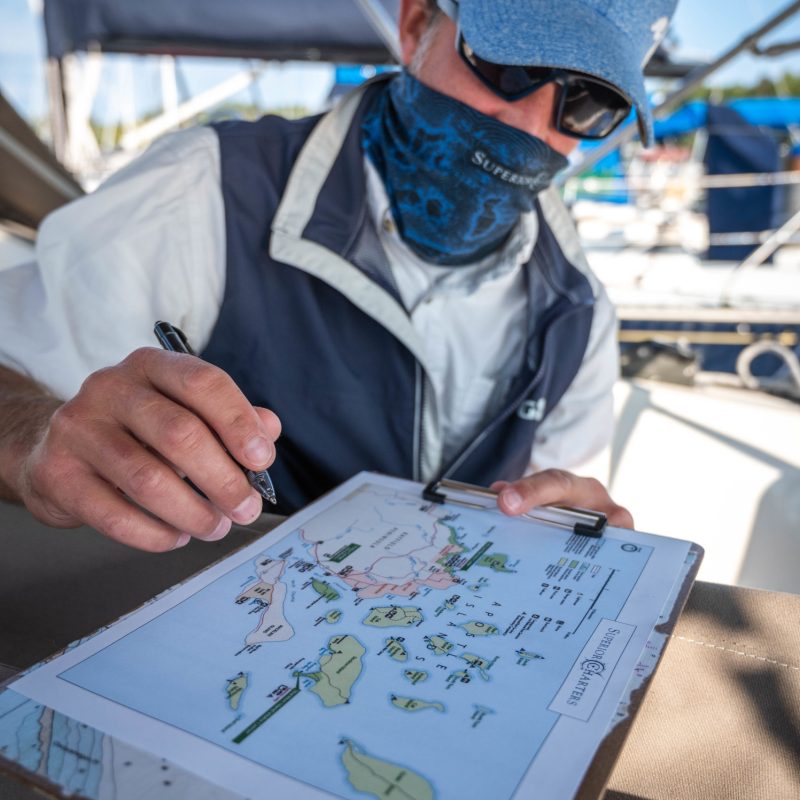 a man sitting at a table using a laptop