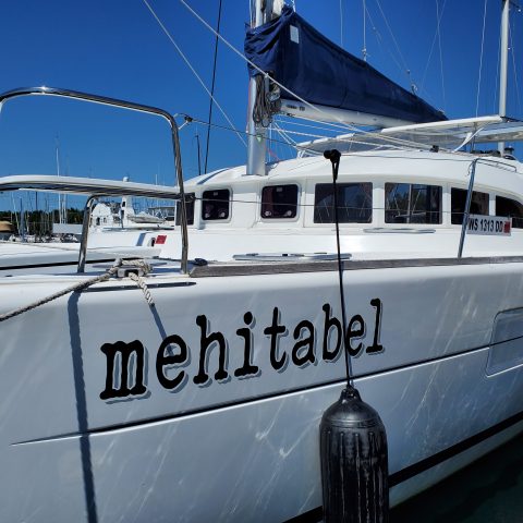 a boat parked on the side of a snow covered slope