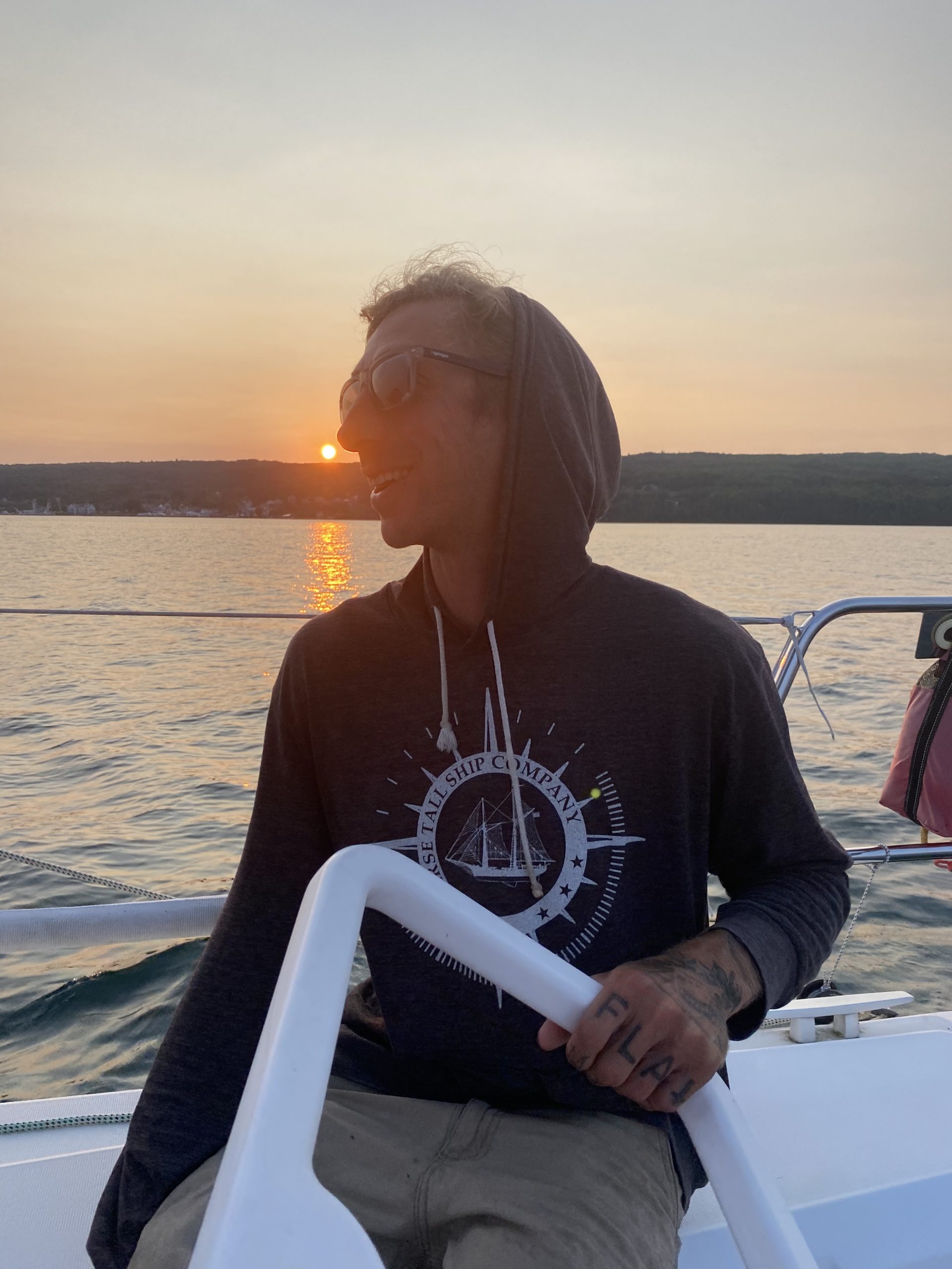 a person standing next to a body of water