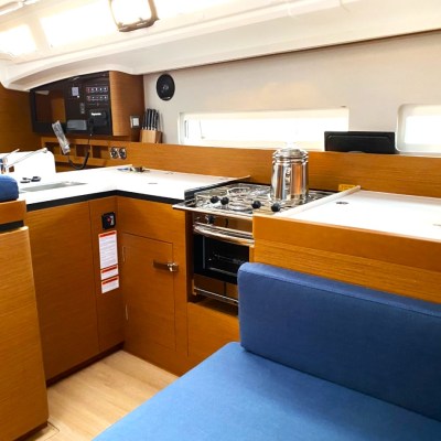 a bedroom with a bed and desk in a room