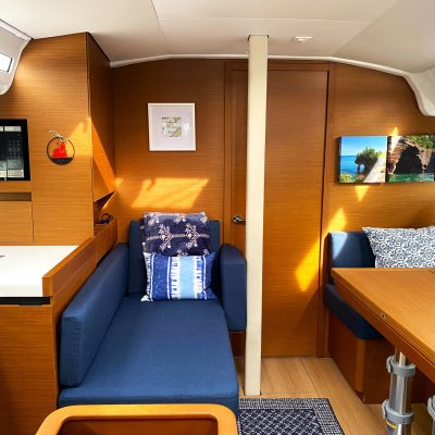a desk with a laptop computer sitting on top of a wooden table