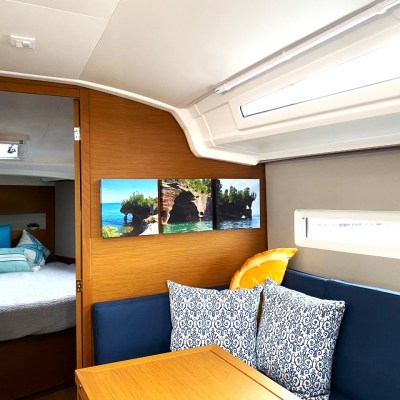 a bedroom with a bed and desk in a room