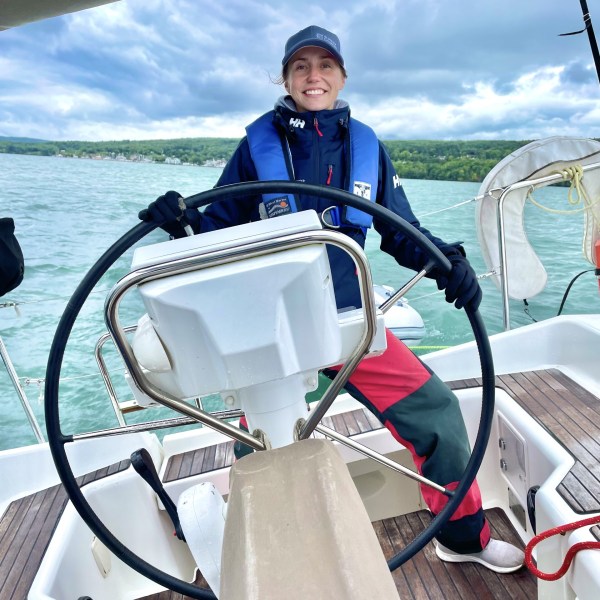 a close up of a boat next to a body of water