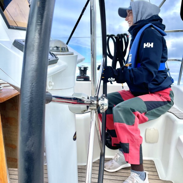a man riding on the back of a boat