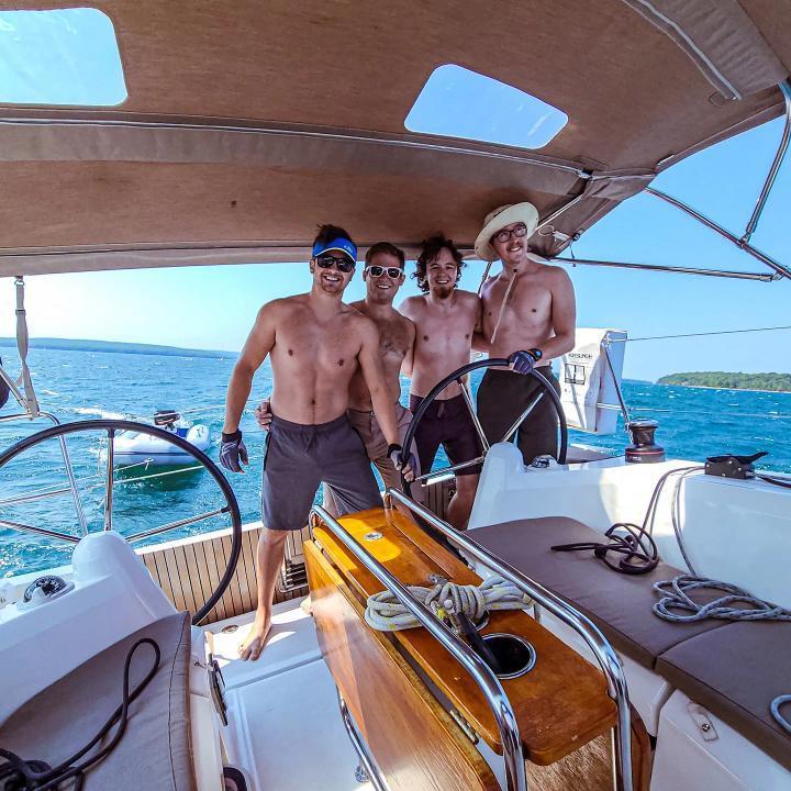 a group of people on a boat in the water