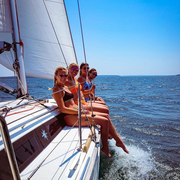 three girls on a boat