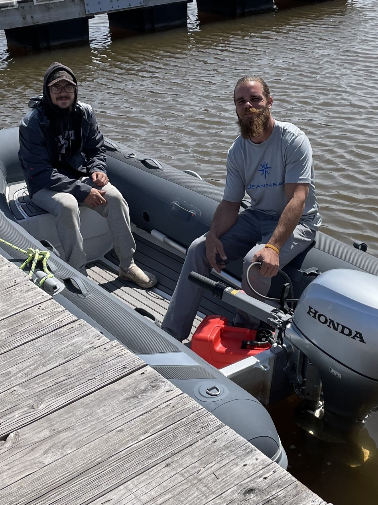 a group of people sitting on a boat in the water