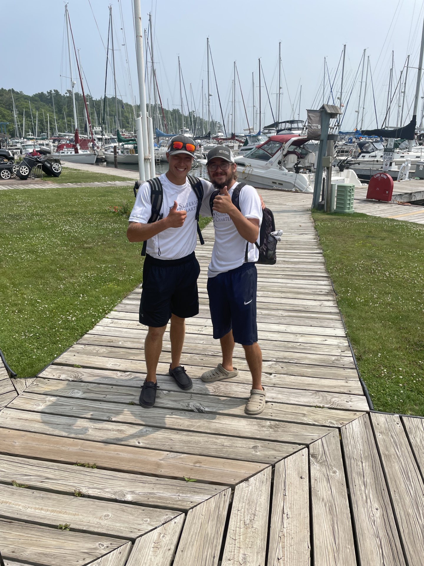 a group of people walking on a sidewalk