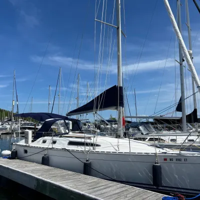 a boat is docked next to a body of water