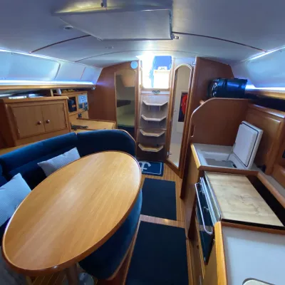 a kitchen with a blue chair