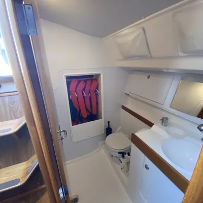 a room with a sink and a mirror