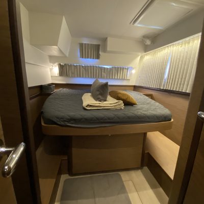 a chair sitting in front of a mirror