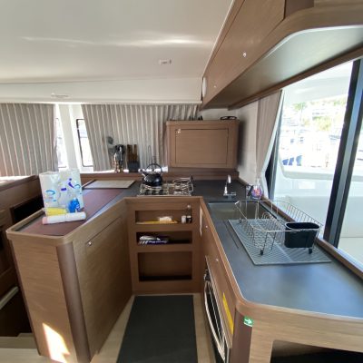 a kitchen with a table in front of a window