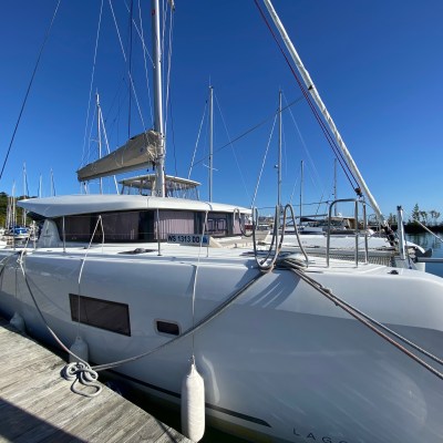 a boat is docked next to a body of water