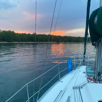 a boat is docked next to a body of water