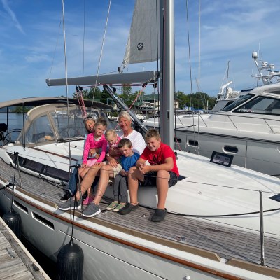 a person standing next to a boat