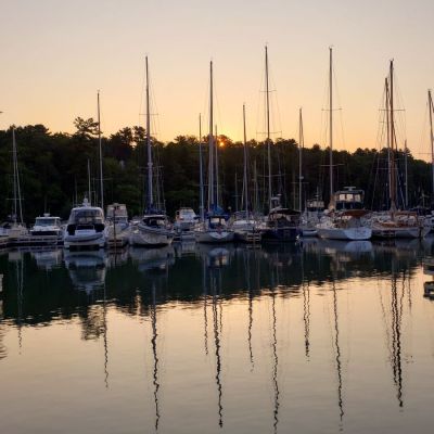 a boat is docked next to a body of water