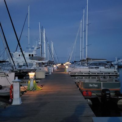 a boat is docked next to a body of water