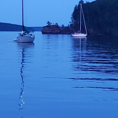 a small boat in a large body of water