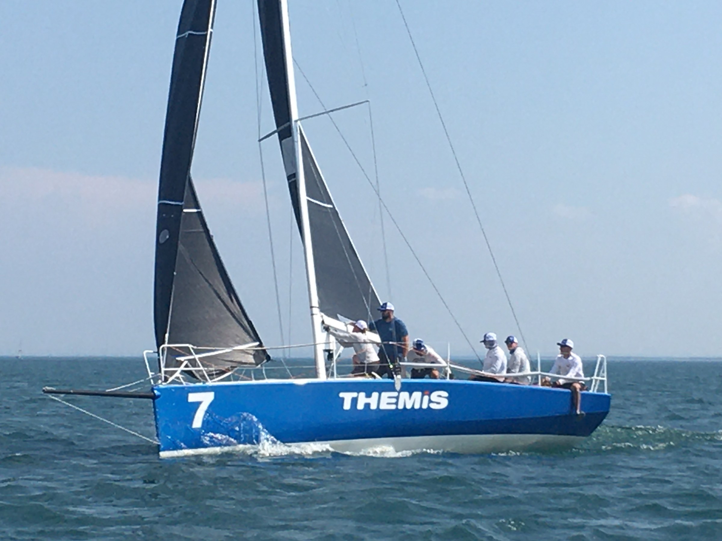 a blue boat on a body of water