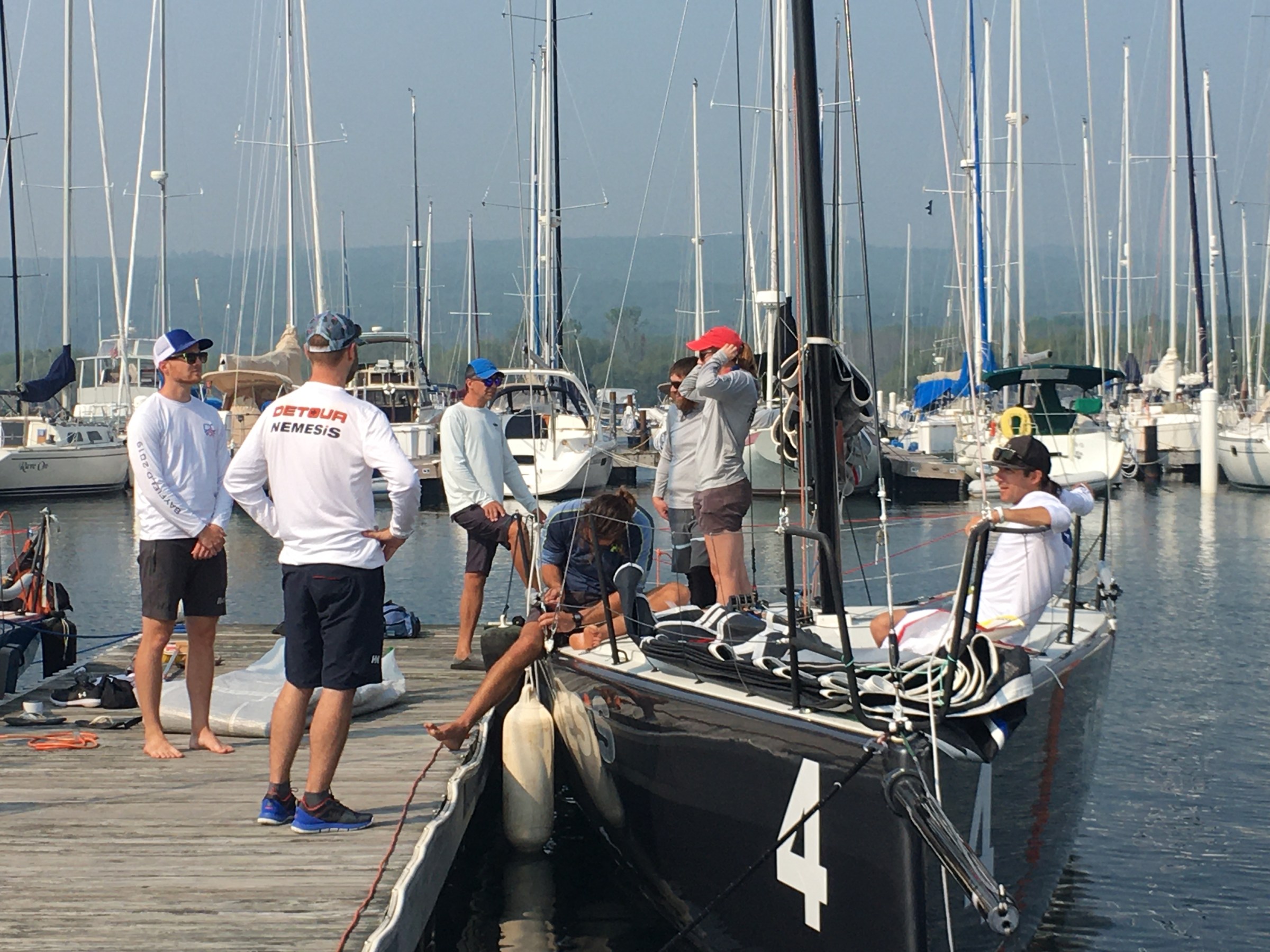 a group of people in a boat docked at a dock