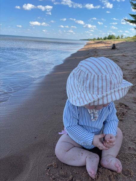a baby in a body of water