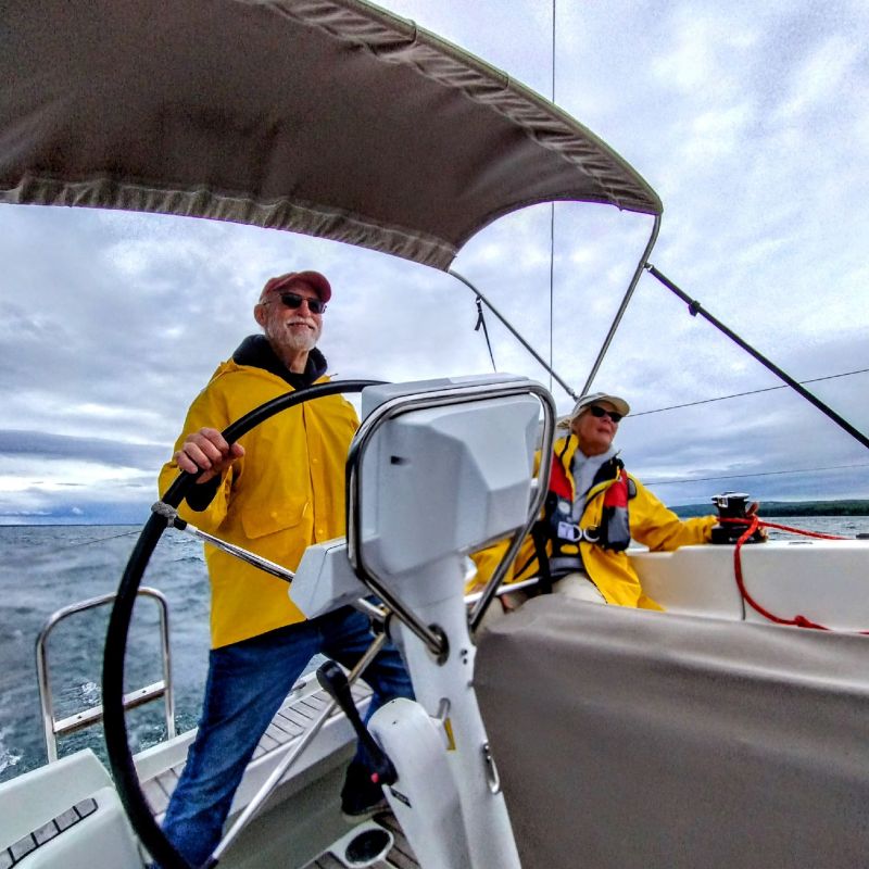 a man riding on the back of a boat